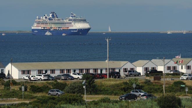 The Celebrity Summit cruise ship sits off Provincetown Harbor last summer. The Harbor and Pier Department has been checking in regularly with several cruise lines that have itineraries in the town this year but has had no official cancellations so far. [Merrily Cassidy/Cape Cod Times file]