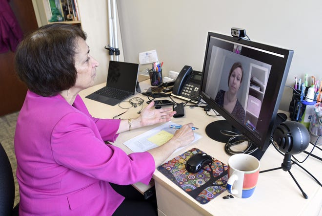 Psychologist Mary Alvord, left, holds a video conference with her colleague, psychologist Veronica Raggi, whom she had scheduled to meet in person, in Chevy Chase, Md., Wednesday, March 18, 2020. For people with anxiety disorders, the coronavirus outbreak presents a new set of worries to deal with, psychologists say. [Steve Ruark/ASSOCIATED PRESS]