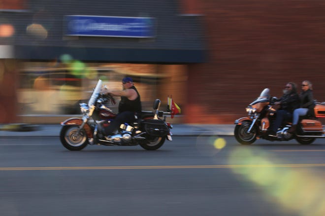 Motorcyclists cruise Main Street on March 24 as part of the inaugural Main Street Food Drive. [Sandra J. Milburn/HutchNews]