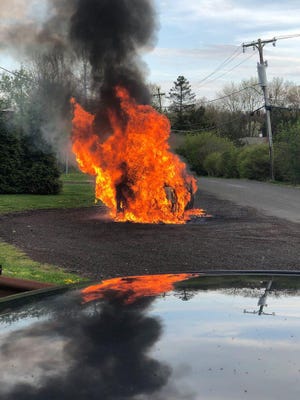 A vehicle was completely destroyed in a fire off of Stump Road in Plumstead Tuesday afternoon. [PHOTO COURTESY OF PLUMSTEAD POLICE]