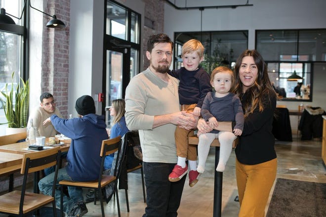 Fox in the Snow Cafe owners Jeff Excell and Lauren Culley with their children, Roman and Maeve, in their German Village shop