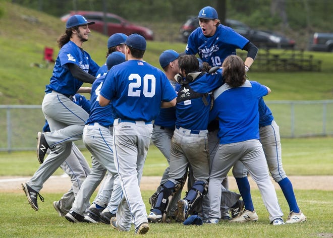 Leominster baseball players pile up to celebrate a win over St. John’s in a Central Mass. Division 1 semifinal at Tivnan Field in 2018. [FILE PHOTO]