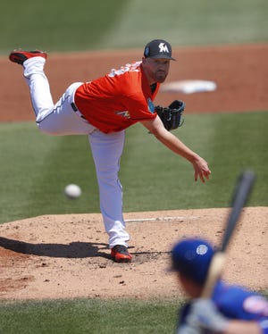 Miami Marlins starting pitcher Dan Straily pitches to a New York Mets batter in the second inning of a March 14, 2018, spring training game in Jupiter, Fla. [AP Photo/John Bazemore, 2018]