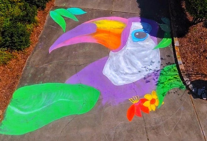 Neighbors on Conifer Way in Shelby decorated their driveway with chalk art to celebrate springtime. [Special to The Star]