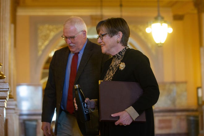 Gov. Laura Kelly and Lee Norman, secretary of the Kansas Department of Health and Environment, arrive Wednesday for a news briefing at the Statehouse. The governor announced her order for residents to stay at home except when necessary will remain in effect until May 3. [Evert Nelson/The Capital-Journal]