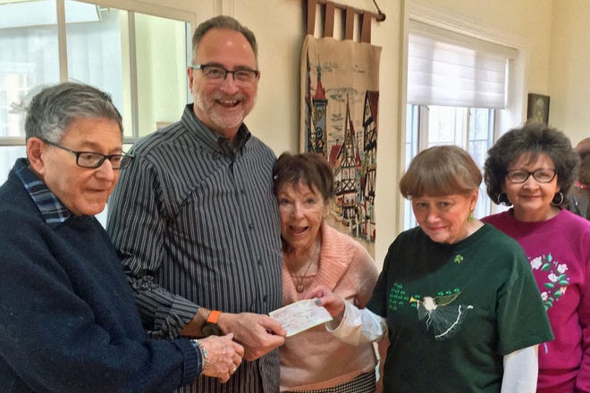 Pictured, from left: Barry Poretsy, Bill Endslow receiving a check, Judy Berkal, Molly Curran presenting the check and Deb Scarborough. [Courtesy Photo]