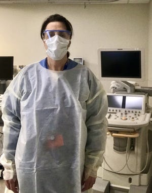 Maria Scibelli Greenberg, the ward councilor for Ward 1, is dressed in her protective gear while working as a cardiac sonographer at Newton-Wellesley Hospital. [Courtesy photo]