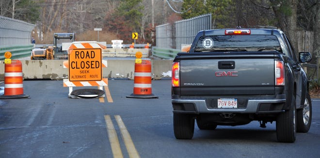 Traffic detours around the Old Bass River Road bridge in South Dennis, which has been closed since a December crash that damaged two of its support beams. Repairs are expected to get underway late this month and be completed by early to mid-June. [FILE PHOTO BY STEVE HEASLIP]