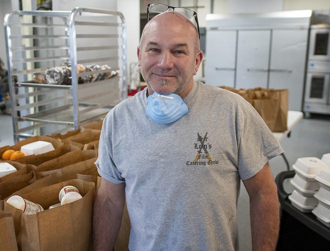 Geoff Kelly, owner of Sir Loin Catering in Northborough, has been dishing out 1,400 free meals a week, with some help from fellow chefs, volunteers and donations from area businesses. [T&G Staff / Rick Cinclair]