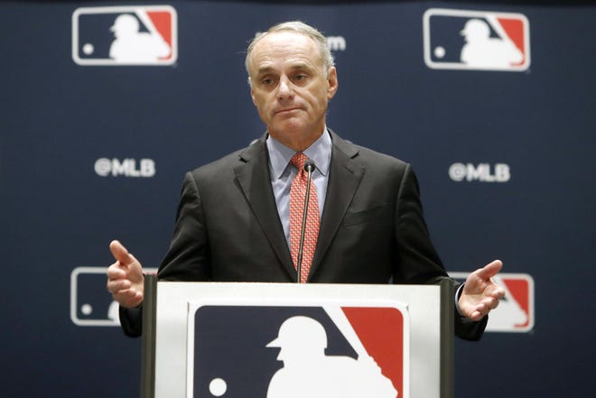 Commissioner of Baseball Rob Manfred gestures while speaking to the media after closing the MLB owners meeting in Arlington,Texas, Thursday, Nov. 21, 2019. (AP Photo/LM Otero)