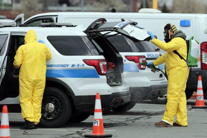 All New Bedford first responder vehicles, city worker vehicles and Sheriff department vehicles were decontaminated by crews with HAZ-MAT experience at the Whale Tale parking lot in New Bedford. 

[ PETER PEREIRA/THE STANDARD-TIMES/SCMG ]