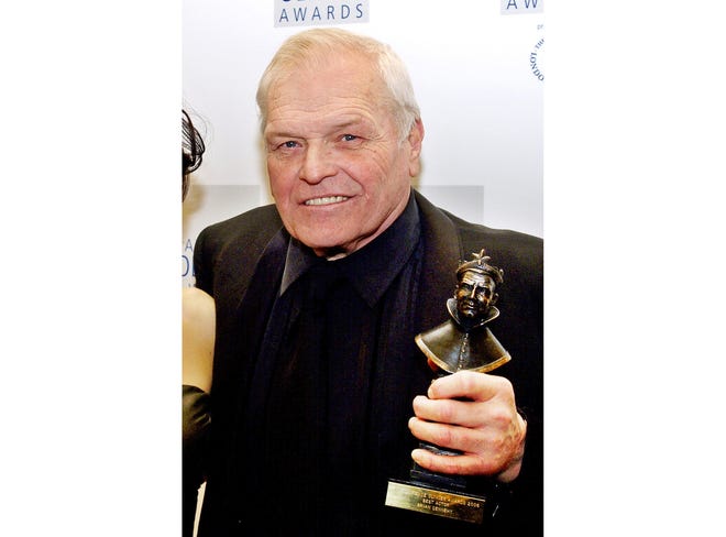 Brian Dennehy with his best actor Olivier Award for his role in "Death of a Salesman," at the 2006 British Theater Lawrence Olivier Awards in London. Dennehy, the burly actor who started in films and later in his career won plaudits for his stage work in plays, died of natural causes April 15. He was 81. [File/The Associated Press]