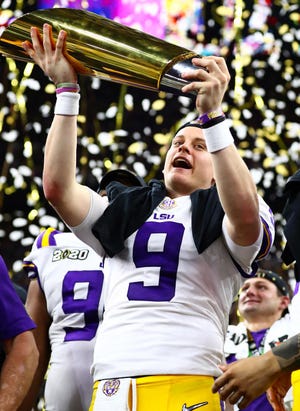 Quarterback Joe Burrow, who recently celebrated a national championship with LSU, is expected to be the No. 1 pick in Thursday’s NFL draft — which will have teams making their picks from remote locations and Burrow watching from his home in Athens. [Matthew Emmons/USA TODAY Sports]