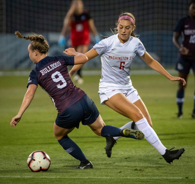 In this Sept. 5, 2019, photo, Washington State forward Morgan Weaver (6) competes for the ball with Gonzaga's Maddie Cooley (9) during a college soccer match in Spokane, Wash. Weaver was selected by the Portland Thorns with the second pick in the National Women's Soccer League draft, The league was supposed to start its season this weekend. (Colin Mulvany/The Spokesman-Review via AP)