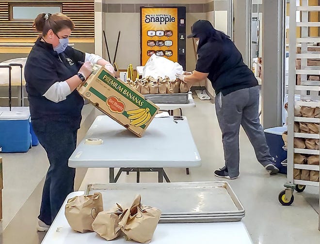 Corning-Painted Post Food Services staff prepare meals for students at the high school cafeteria. [Provided]