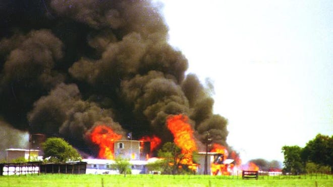 Fire burns Mount Carmel, the Branch Davidian compound, on April 19, 1993, outside Waco. [AMERICAN-STATESMAN]