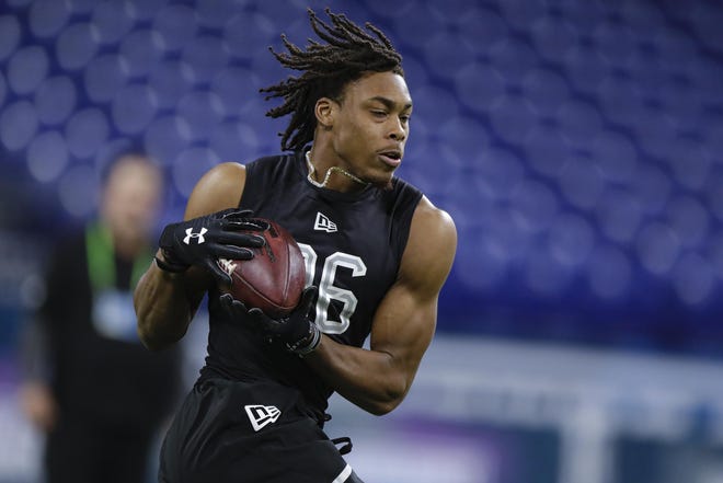 LSU wide receiver Justin Jefferson catches a pass at the NFL Scouting Combine. [MICHAEL CONROY / ASSOCIATED PRESS]