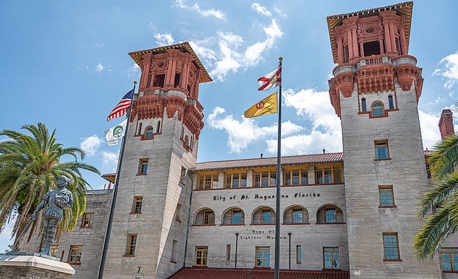 Flags fly in front of St. Augustine’s city hall on Thursday, April 9, 2020. [PETER WILLOTT/THE RECORD]