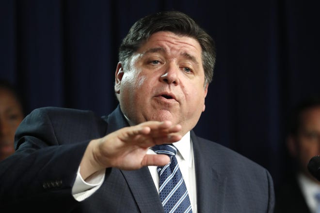 Illinois Gov. J.B. Pritzker responds to a question at an earlier news conference about the COVID-19 pandemic. [AP Photo/Charles Rex Arbogast]