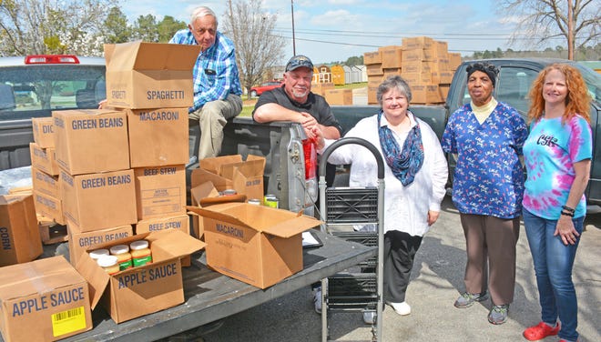 Johnny Still (left), the president of the Barnwell Branch of the Church of Jesus Christ of Latter Day Saints, and Dennis Knapp (second from left), the Branch Clerk, picked up two pallets full of food on March 13 that was part of a delivery to Aiken. They brought the food back to Barnwell to help local food pantries and feeding programs. Also pictured is Knapp's wife Linda who works with the church's Just Serve program, Cora Berry from Christ Central Ministries in Allendale, and Sherrie Still from the Barnwell Community Soup Kitchen. [Jonathan Vickery / Managing Editor]
