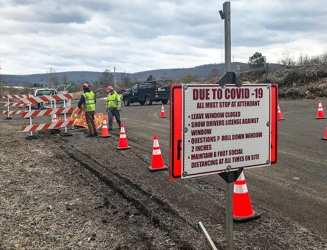 Corning Department of Public Works crews work Tuesday to prepare the city yard waste site, off State Route 414, which will be open from 10 a.m.-2 p.m. Saturday. The yard waste site will be open from 10 a.m.-2 p.m. each Saturday through June 27. [Jeff Smith/The Leader]