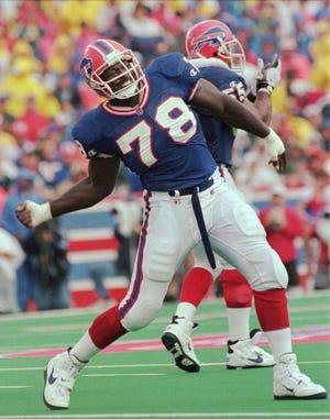 Defensive end Bruce Smith, the No. 1 overall draft pick by Buffalo in 1985, was the foundation for a defense that helped Buffalo play in four straight Super Bowls. [AP Photo/Kevin Higley, 1996 file]