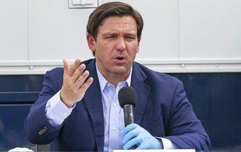 Florida Governor Ron DeSantis speaks at the Miami Beach Convention Center to discuss the U.S. Army Corps' building of a coronavirus field hospital inside the facility on Wednesday, April 8, 2020. The governor’s Re-Open Florida Task Force met Tuesday to discuss how to end the statewide lockdown and restart the economy.