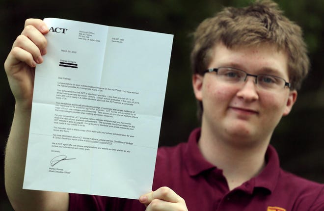 Padraig Harris holds the letter he received for making a perfect score on the ACT. [Brittany Randolph/The Star]