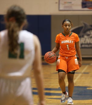 Mosley’s Ja’Mya Broglen dribbles the ball up the court during a game against Seminole County in the Marlin Christmas Classic on Dec. 30, 2019. [PATTI BLAKE/THE NEWS HERALD]