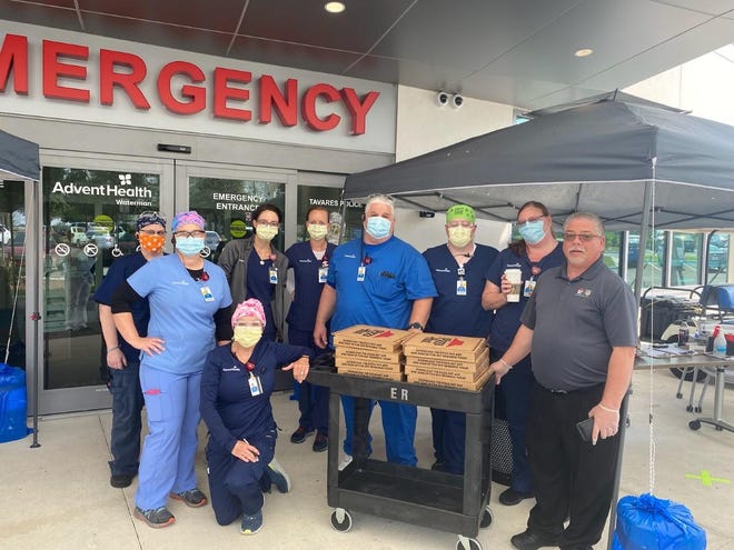 AdventHealth Waterman staff pose with Pizza Hut pizzas. To donate to the hospital’s “Feed the Frontline” program, call the AdventHealth Waterman Foundation at 352-253-3270 or visit hospital’s website to