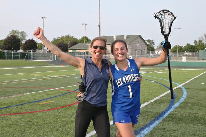 Middletown girls lacrosse coach Lisa Cecchi and daughter Isabella Cecchi are jubilant after leading the Islanders to the Division II crown in 2019. [LOUIS WALKER III FILE PHOTO]