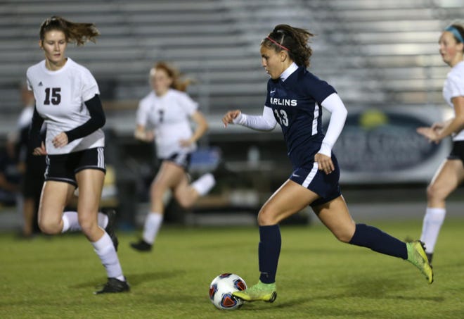 Arnold’s Olivia Lebdaoui (13) dribbles the ball up the field during a district championship game against Pensacola on Feb. 4, 2020 at Arnold. [PATTI BLAKE/THE NEWS HERALD]