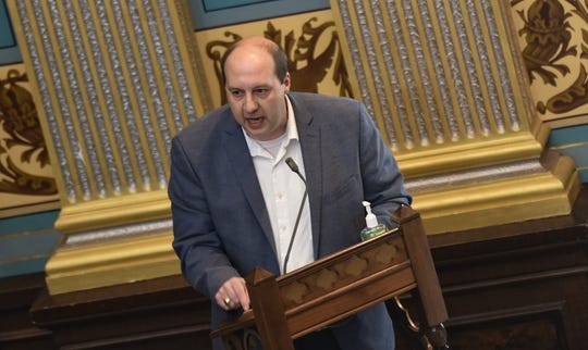 Sen. Curtis Hertel, Jr., (D-East Lansing) addresses fellow lawmakers Friday, April 24, 2020, on the senate floor. The Michigan legislature met Friday to vote on the creation of a committee that will oversee Gov. Gretchen WhitmerþÄôs response to the coronavirus pandemic. The Senate also will vote on a pair of bills that will limit the governorþÄôs executive power during a crisis, which Whitmer has promised to veto. [Matthew Dae Smith/Lansing State Journal]