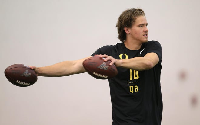 Former Oregon quarterback Justin Herbert works out for pro scouts on March 12 at the Moshofsky Center. [Chris Pietsch/The Register-Guard] - registerguard.com