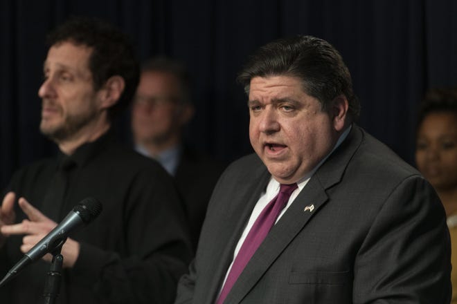Illinois Gov. JB Pritzker and elected and health officials give a daily update on the coronavirus in Illinois in this file photo. [TYLER LARIVIERE/CHICAGO SUN-TIMES VIA AP]