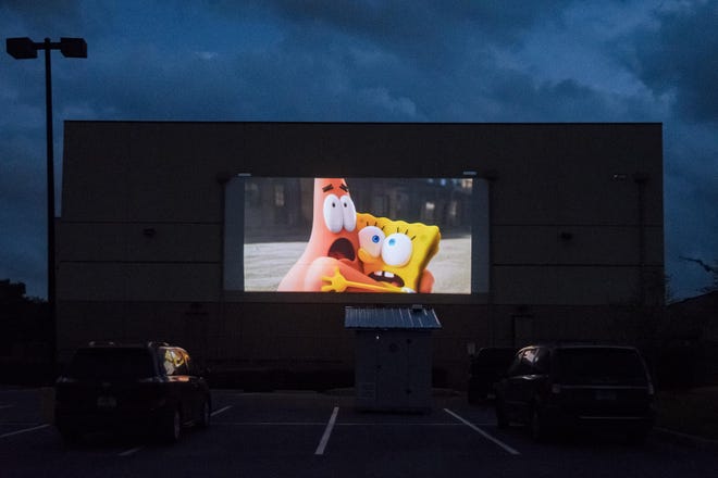 Movie previews are shown outside the Epic Theater at the Clermont Landing shopping center in Clermont on Tuesday, March 31, 2020. [PAUL RYAN / CORRESPONDENT]