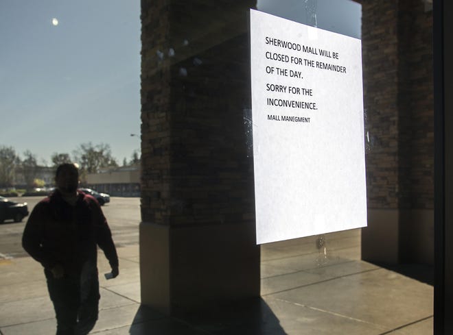 A sign posted at the entrance to Sherwood Mall indicates the mall is closed in the wake of a March 11 homicide. [CLIFFORD OTO/THE STOCKTON RECORD FILE 2020]