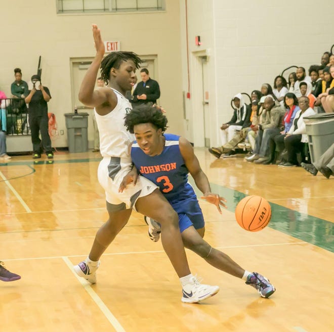 Johnson's Emondre Bowles (3) drives toward the basket while being blocked by Windsor Forest's Jaquan Kearse during a game last season at Windsor Forest. Bowles is the Savannah Morning News Boys Basketball Player of the Year for 2019-20. [RANDY THOMPSON/SAVANNAHNOW.COM FILE PHOTO]