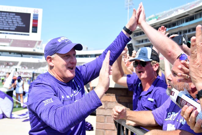 Kansas State coach Chris Klieman celebrates with fans after the Wildcats’ victory at Mississippi State last Sept. 14. [MATT BUSH/USA TODAY]