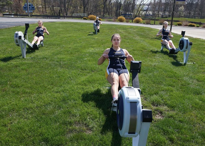 Demonstrating their techniques on machines are Bay view rowers, front, Emma Leary; left, Lily Sarnowski; back, Victoria Miller-Tuchon; and Lindsey Williams. [The Providence Journal / Sandor Bodo]