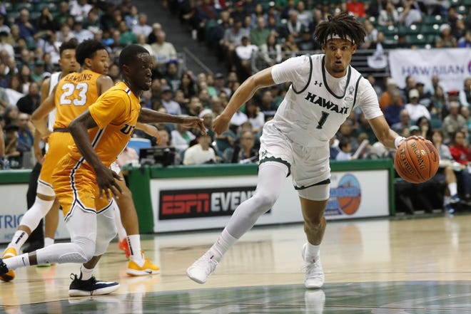 Hawaii guard Drew Buggs (1) drives toward the basket during a game against UTEP on Dec. 22 in Honolulu. The 6-foot-1 Buggs is joining Missouri as a graduate transfer and will be immediately eligible to play. [Marco Garcia/The Associated Press]