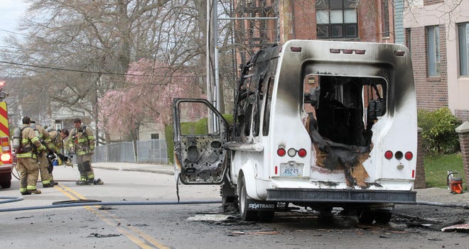 Members of the Newport Fire Department are on the scene after a van caught fire on Van Zandt Avenue on Tuesday morning. [SCOTT BARRETT/DAILY NEWS PHOTO]