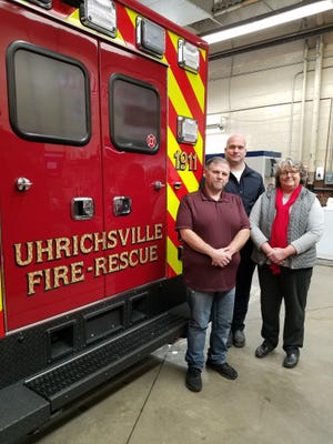 Uhrichsville Mayor Mark Haney, Fire Chief Justin Edwards and city Auditor Julie Pearch were among those promoting renewal of levies for fire department equipment and ambulance service. (TimesReporter.com / Nancy Molnar)