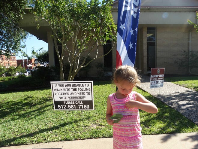 Chandler Parsons, 5, puts on a "Future Voter" sticker outside Smithville City Hall on Election Day, May 6, 2017. Her grandmother cast her ballot in the city and school board elections. [MARY HUBER/SMITHVILLE TIMES FILE]