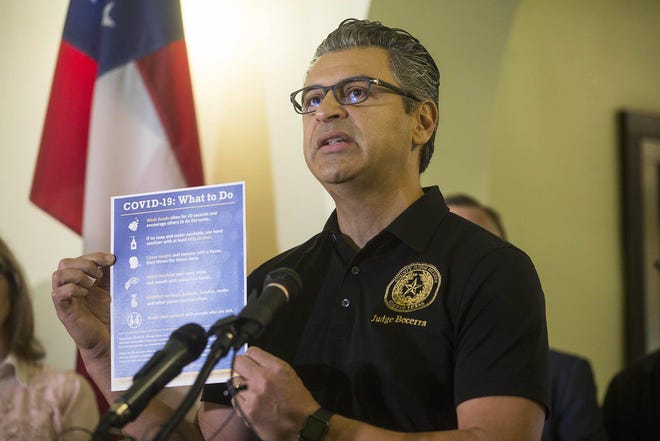 Hays County Judge Ruben Becerra announces a state of disaster at the Hays County Courthouse on March 15. [MIKALA COMPTON FOR STATESMAN]