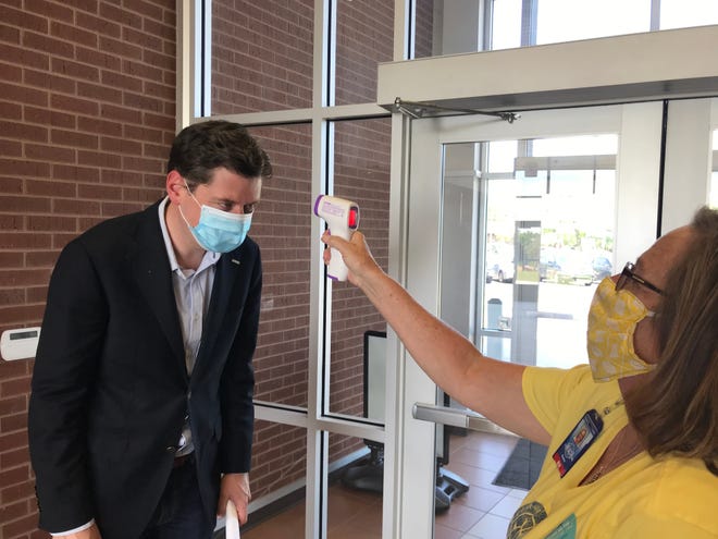 Oklahoma City Mayor David Holt had his temperature taken before a COVID-19 press briefing earlier this year. Personal responsibility is a must as cases surge, he says. [The Oklahoman Archive]