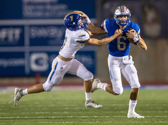 Westlake quarterback Cade Klubnik stiff-arms Anderson defensive back Blaise Darbyshire last season. Klubnick, who will be a junior, will step into the starter’s role this season for the Class 6A Division II defending champion. [JOHN GUTIERREZ/FOR STATESMAN]