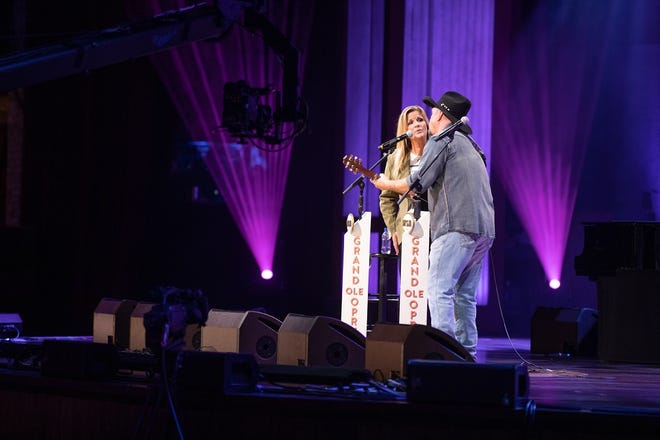 Opry members Garth Brooks and Trisha Yearwood stepped into the circle Saturday night, bringing fans from all around the world together for the Grand Ole Opry's 4,922nd consecutive Saturday night broadcast. [Chris Hollo/Grand Ole Opry]