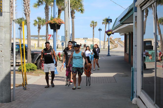 Following Georgia Gov. Brian Kemp's shelter-in-place order issued on Thursday, April 2, which mandated reopening all beaches statewide, scores of beachgoers visited Tybee Island on Saturday, April 4. [Nick Robertson/SavannahNow.com]