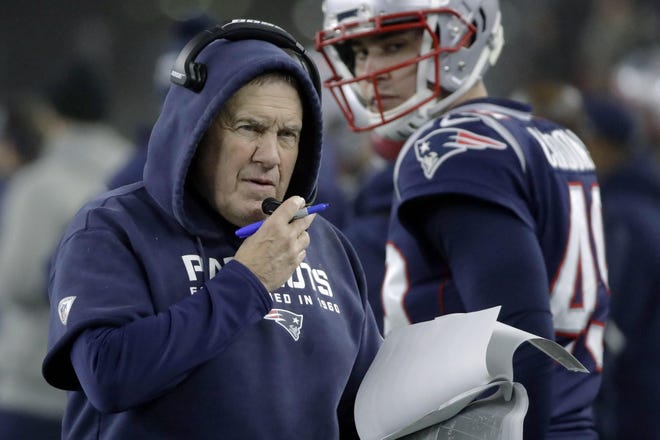 New England Patriots coach Bill Belichick works along the sideline during the first half of a Jan. 4 wild card game against the Tennessee Titans in Foxborough, Massachusetts. This could be the year Buffalo, Miami or the New York Jets end New England's reign at the top of the division after winning 17 titles in 19 years with Tom Brady as quarterback. But Belichick is still running things for the Patriots. That has all of their AFC East rivals still wary and not quite ready to say the division is up for grabs. [Elise Amendola Associated Press FIle]
